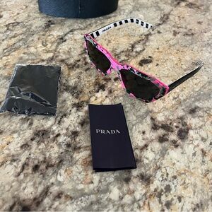 Prada PR 03VS-4625S0 MILLENNIALS Sunglasses Camouflage pink w/Black Lens 57mm